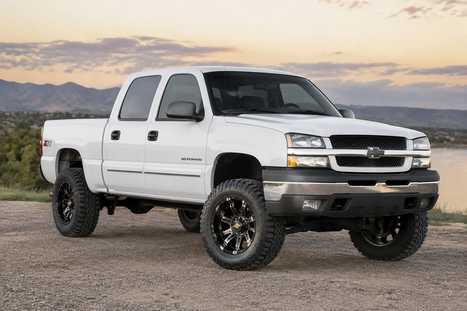A while 2005 Chevy Silverado 1500 with a 3 inch lift, 17inch black chrome, wi...