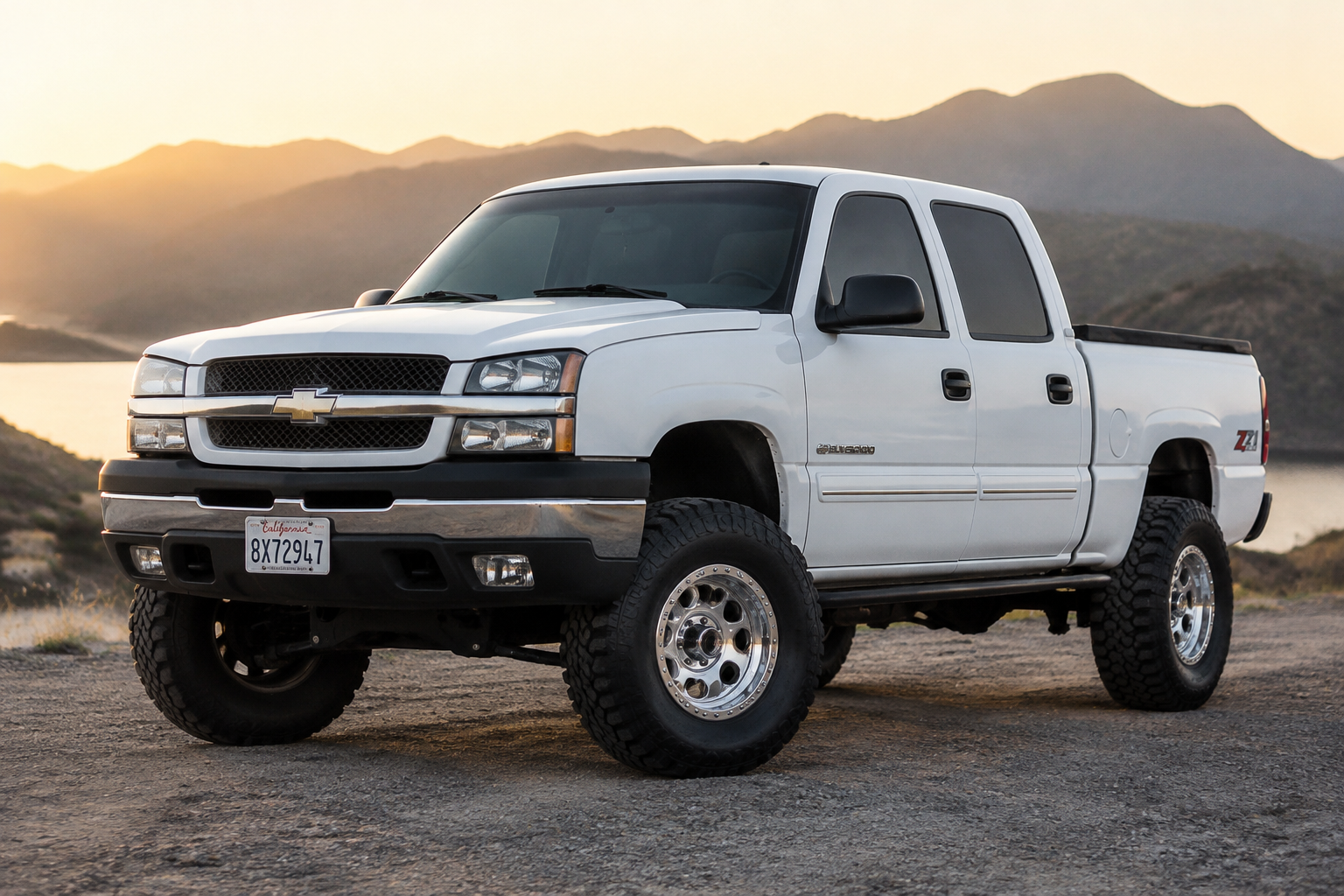 Summit white 2005 Chevy Silverado 1500 with a 3 inch lift, 17 inch chrome bea...